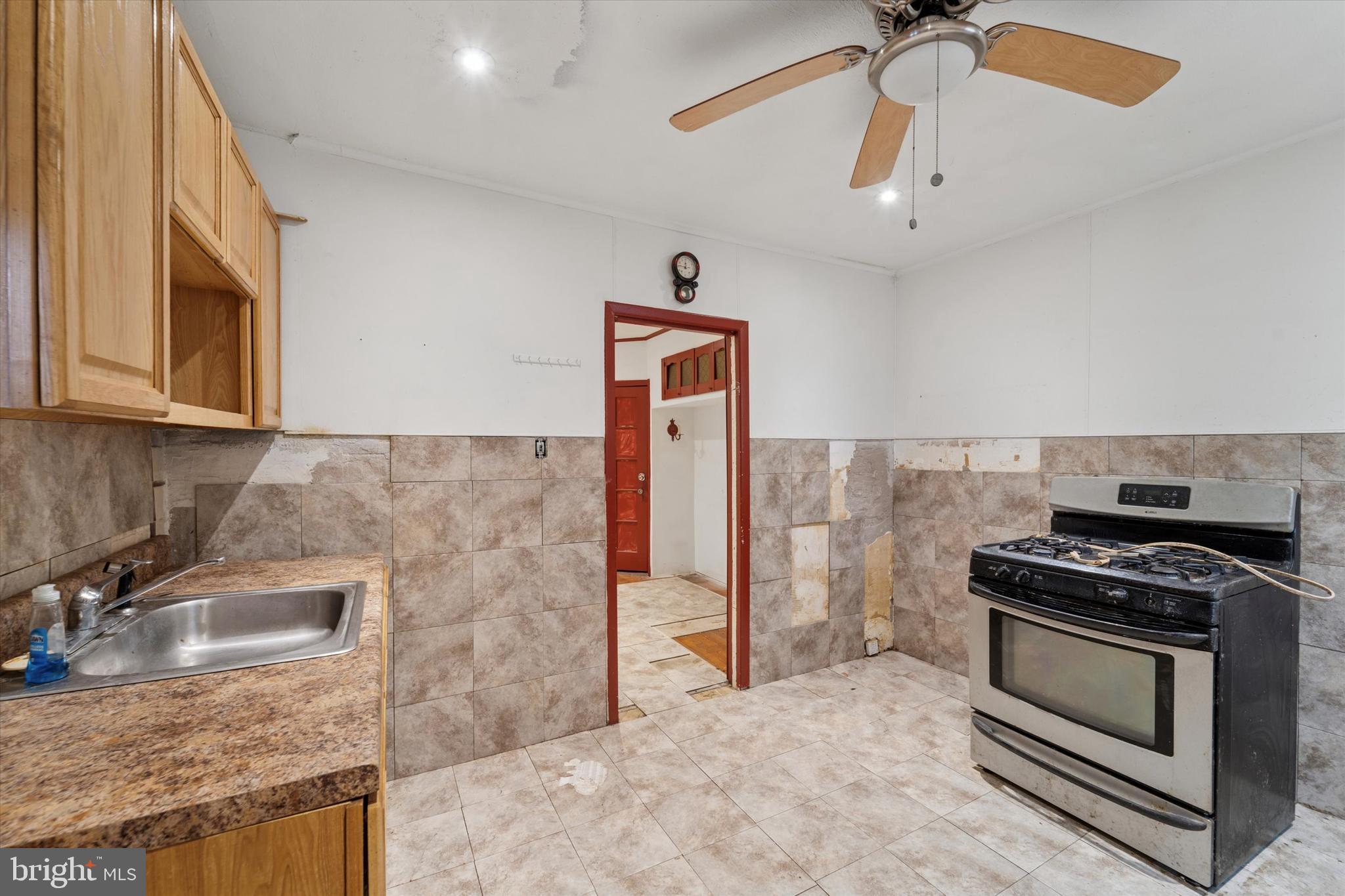 7250 Radbourne Road Upper Darby, PA 19082 - Photo 7 of 15 a kitchen with stainless steel appliances granite countertop a stove and a sink
