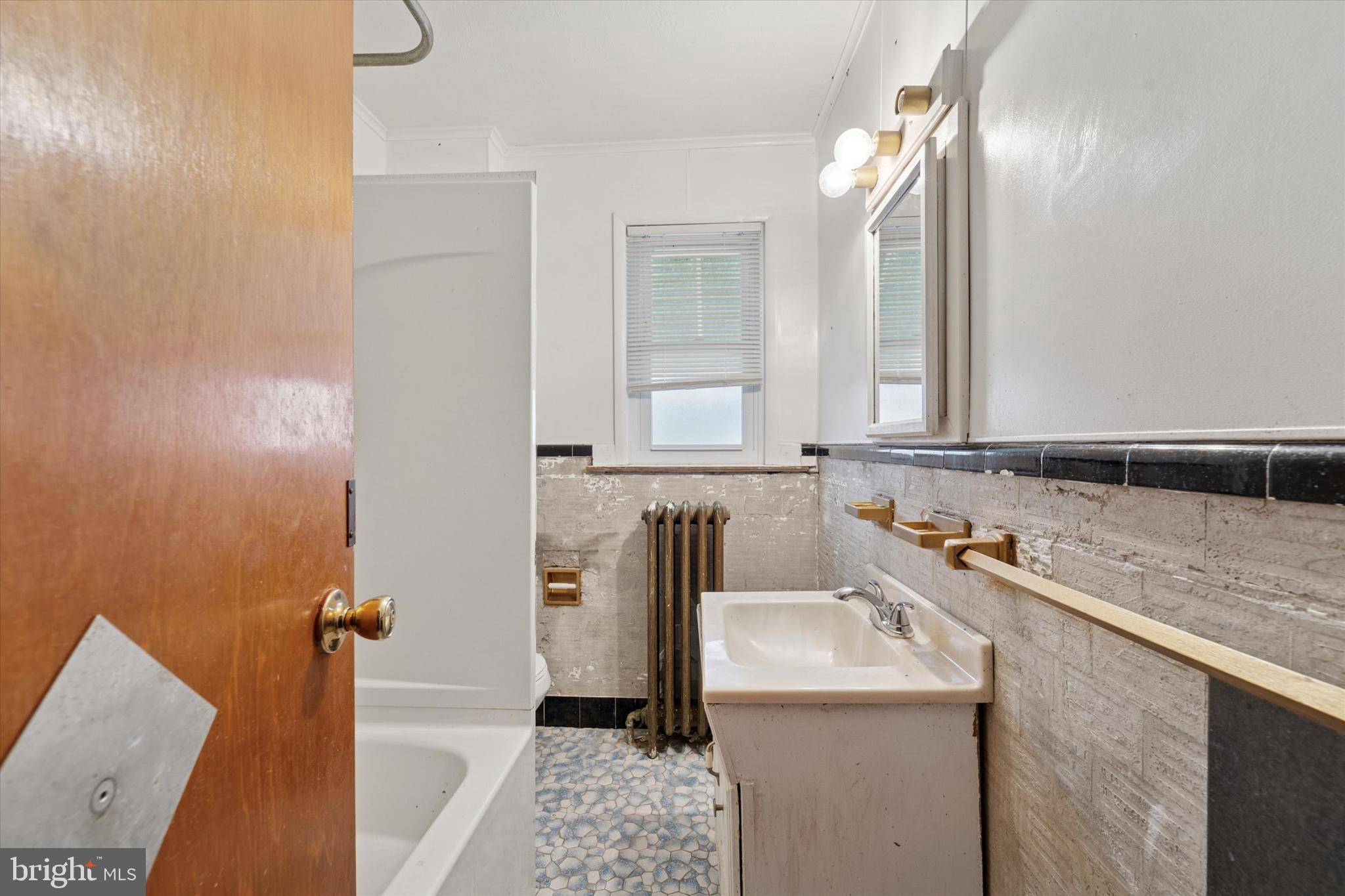 7250 Radbourne Road Upper Darby, PA 19082 - Photo 9 of 15 a bathroom with a sink and a mirror