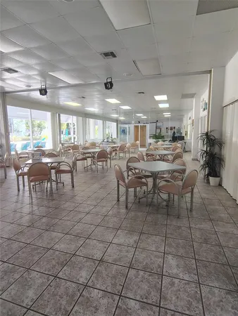 a view of swimming pool with outdoor seating and plants