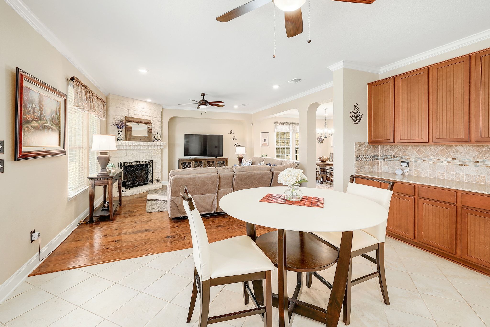 646 Landon Samuel Loop Pflugerville, TX 78660 - Photo 12 of 40 a view of a dining room with furniture and wooden floor