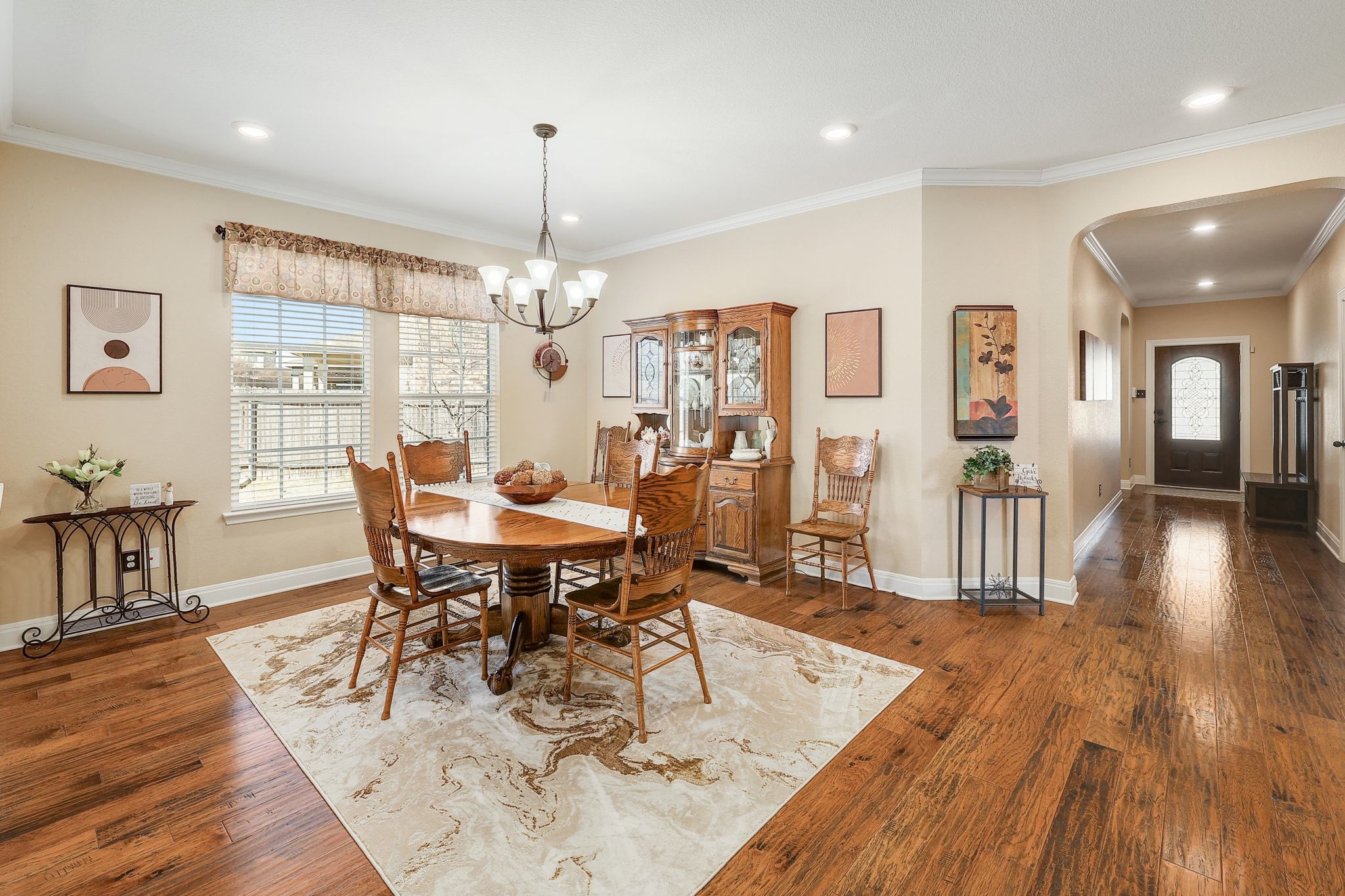 646 Landon Samuel Loop Pflugerville, TX 78660 - Photo 15 of 40 a view of a dining room with furniture and wooden floor