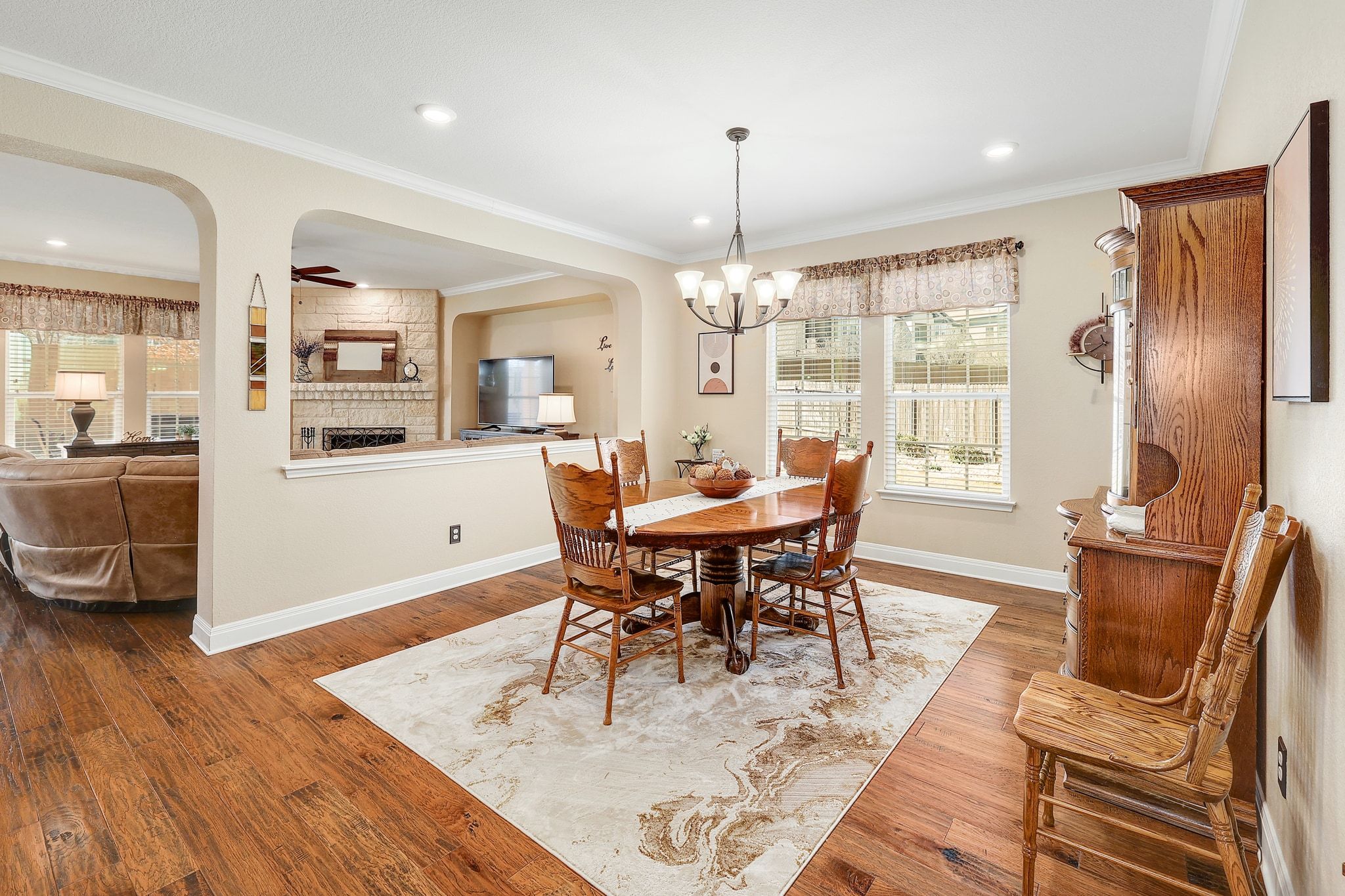 646 Landon Samuel Loop Pflugerville, TX 78660 - Photo 16 of 40 a view of a dining room with furniture window and wooden floor