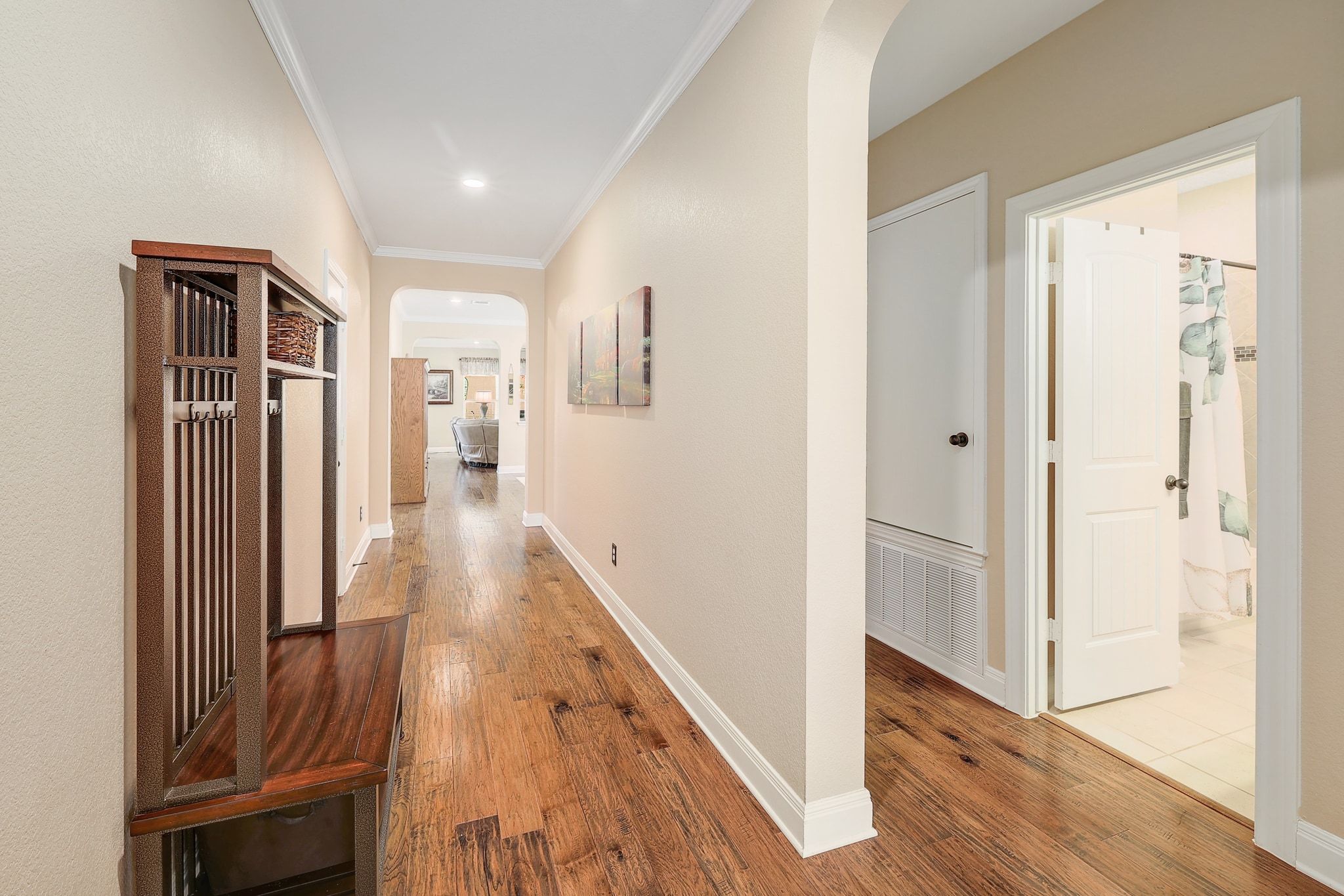 646 Landon Samuel Loop Pflugerville, TX 78660 - Photo 18 of 40 a view of a hallway with wooden floor and staircase