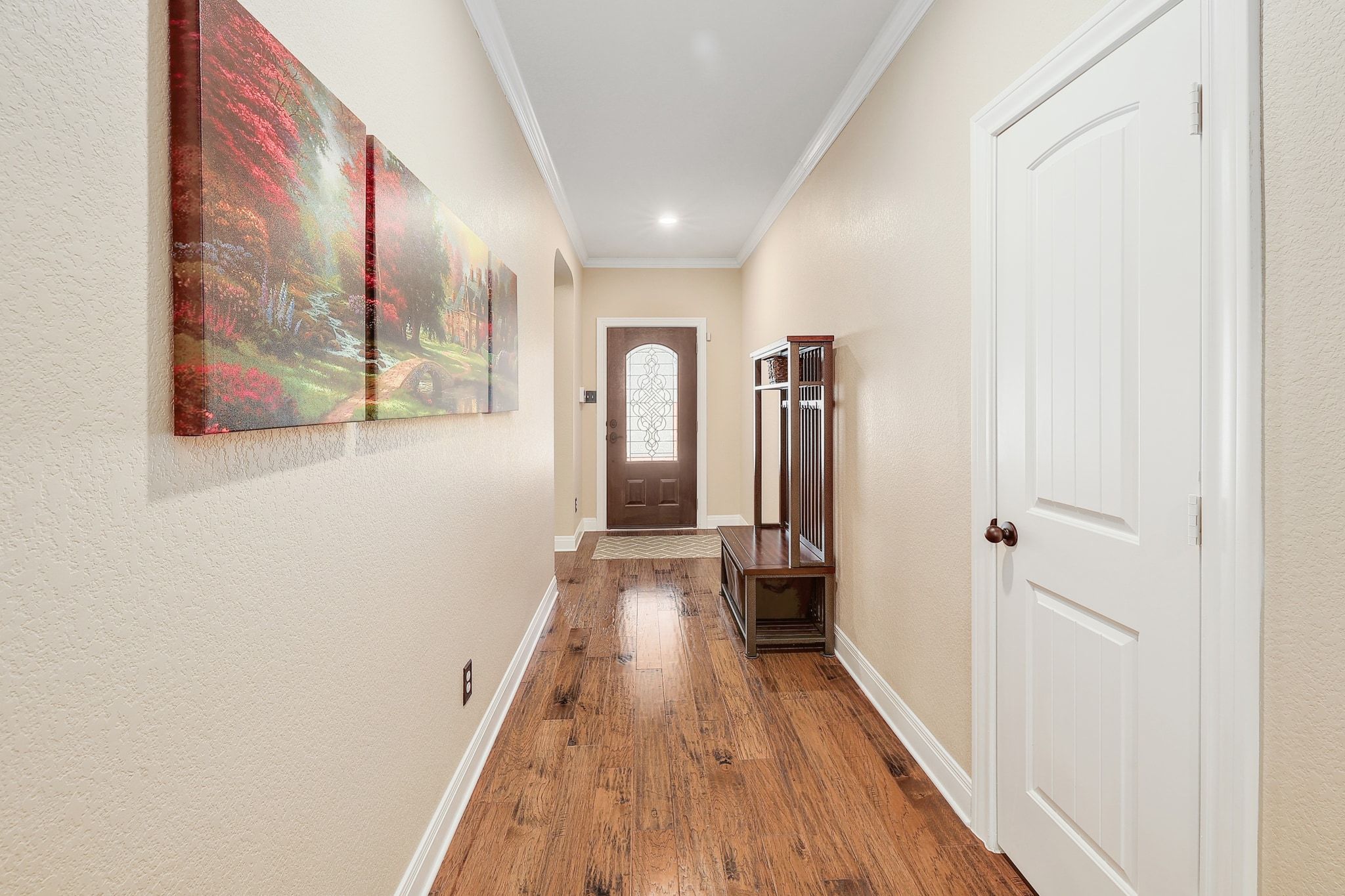 646 Landon Samuel Loop Pflugerville, TX 78660 - Photo 19 of 40 a view of a hallway with wooden floor