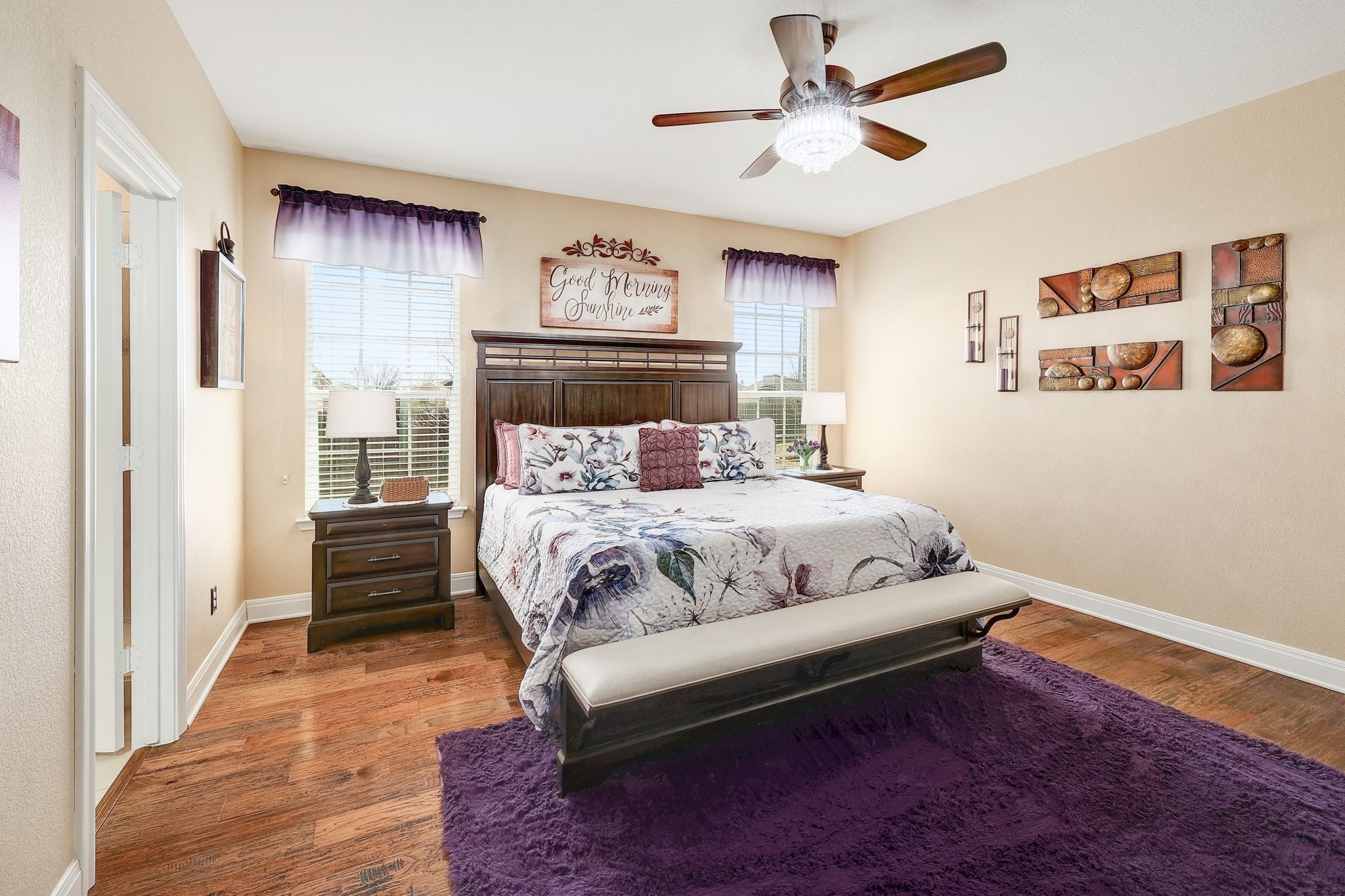 646 Landon Samuel Loop Pflugerville, TX 78660 - Photo 20 of 40 a bedroom with a bed and a chandelier