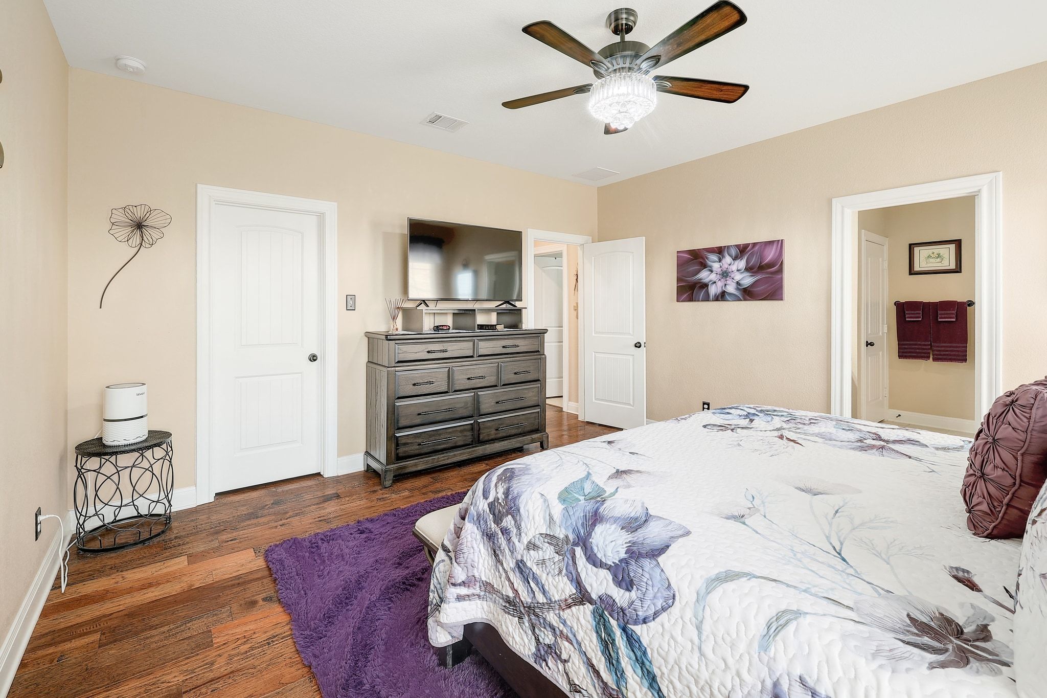 646 Landon Samuel Loop Pflugerville, TX 78660 - Photo 22 of 40 a bedroom with a bed and a flat screen tv