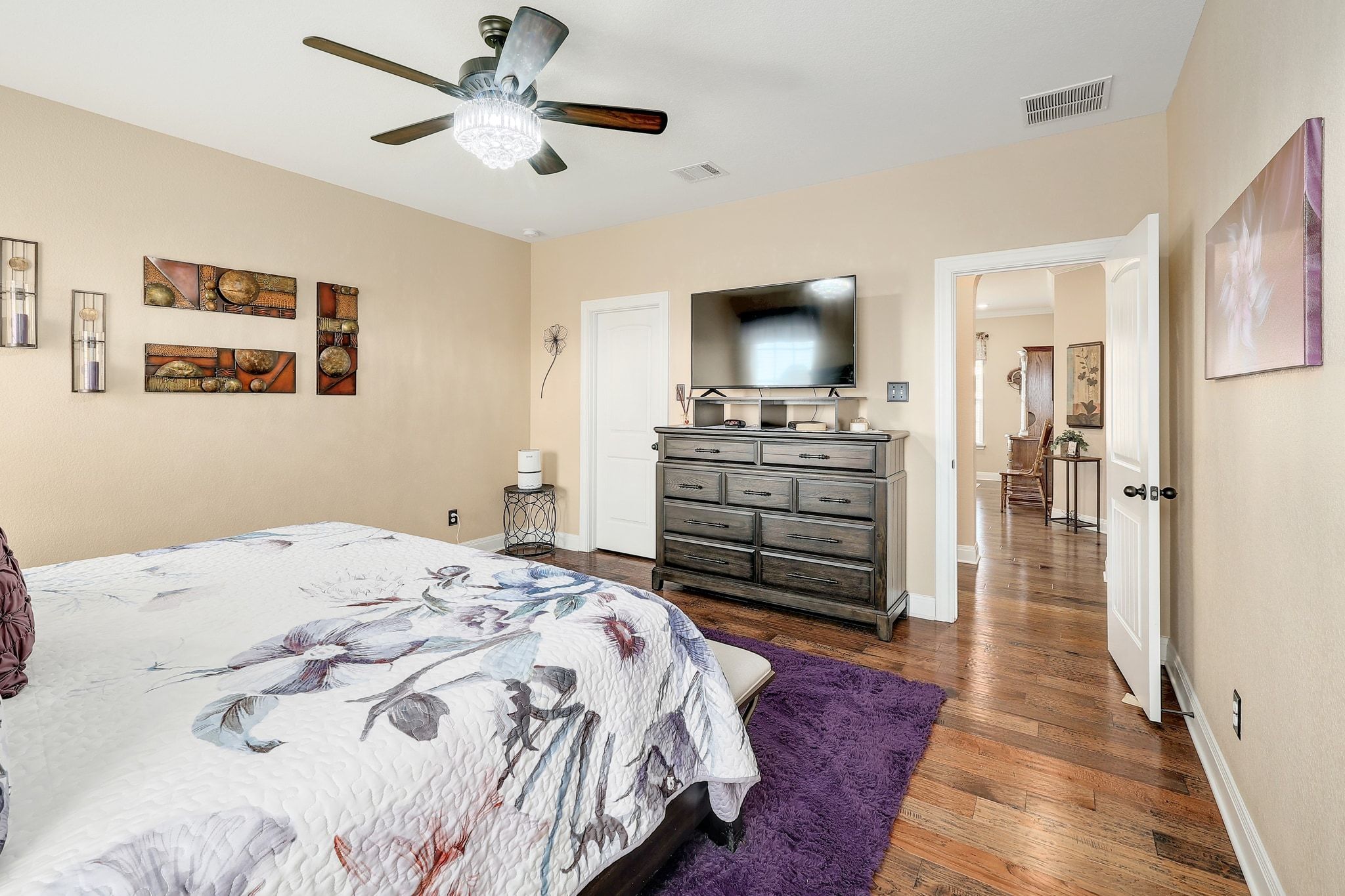 646 Landon Samuel Loop Pflugerville, TX 78660 - Photo 23 of 40 a bedroom with a bed and a flat screen tv