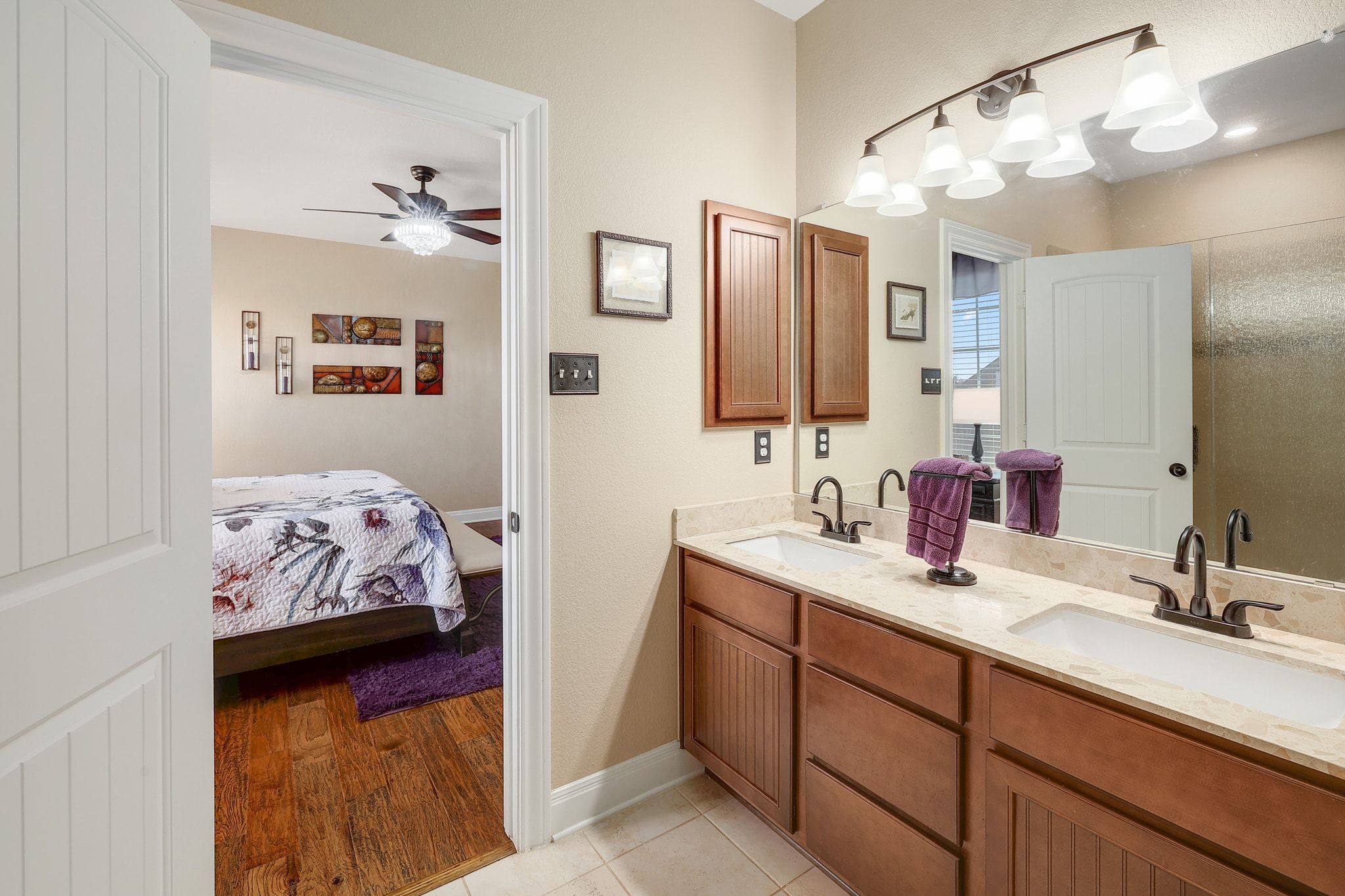 646 Landon Samuel Loop Pflugerville, TX 78660 - Photo 24 of 40 a en suite spacious bathroom with a double vanity sink and a mirror
