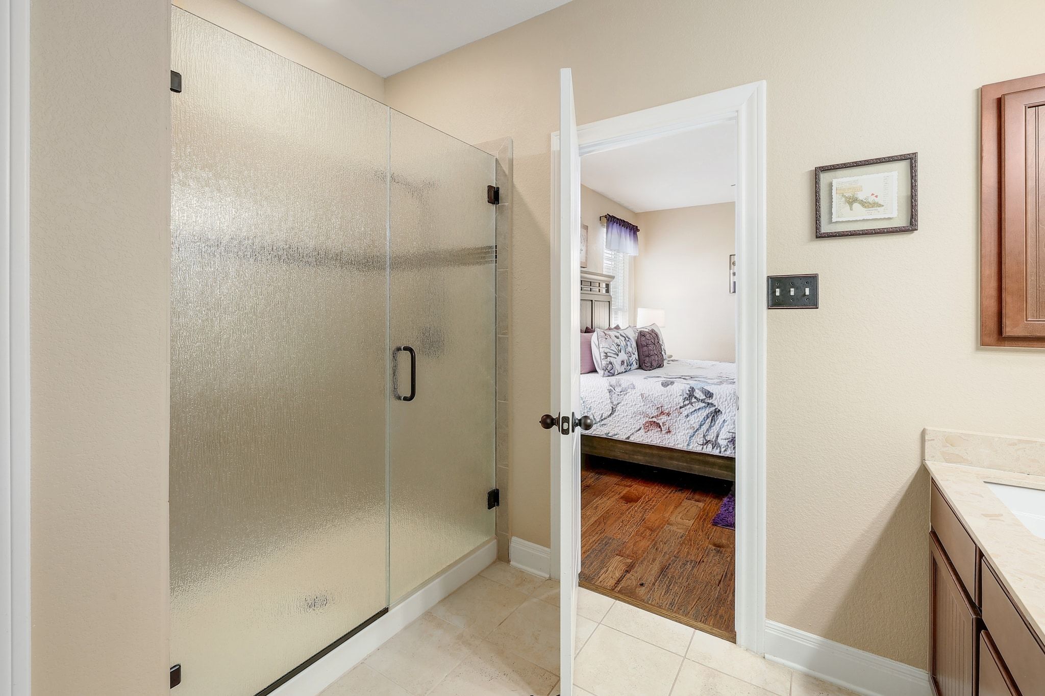 646 Landon Samuel Loop Pflugerville, TX 78660 - Photo 26 of 40 a en suite bathroom with a shower