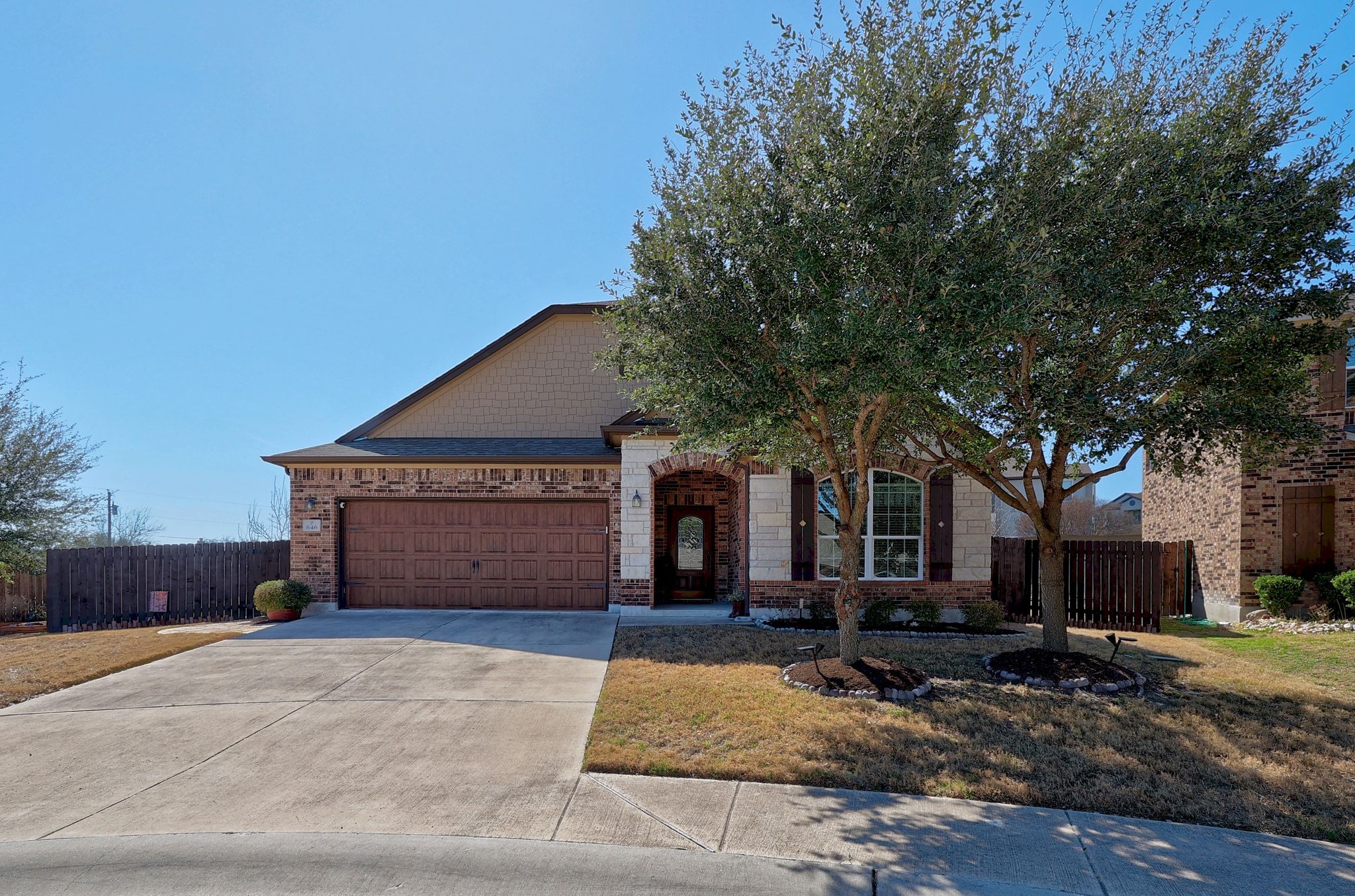 646 Landon Samuel Loop Pflugerville, TX 78660 - Photo 3 of 40 a front view of a house with a yard and garage