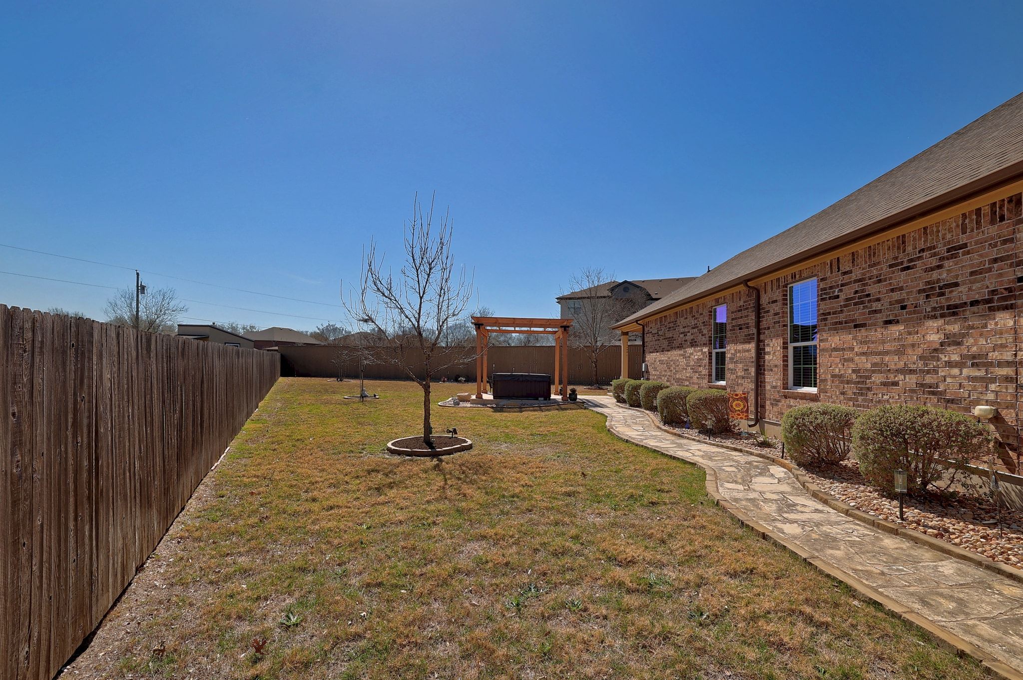 646 Landon Samuel Loop Pflugerville, TX 78660 - Photo 39 of 40 a view of a backyard of the house