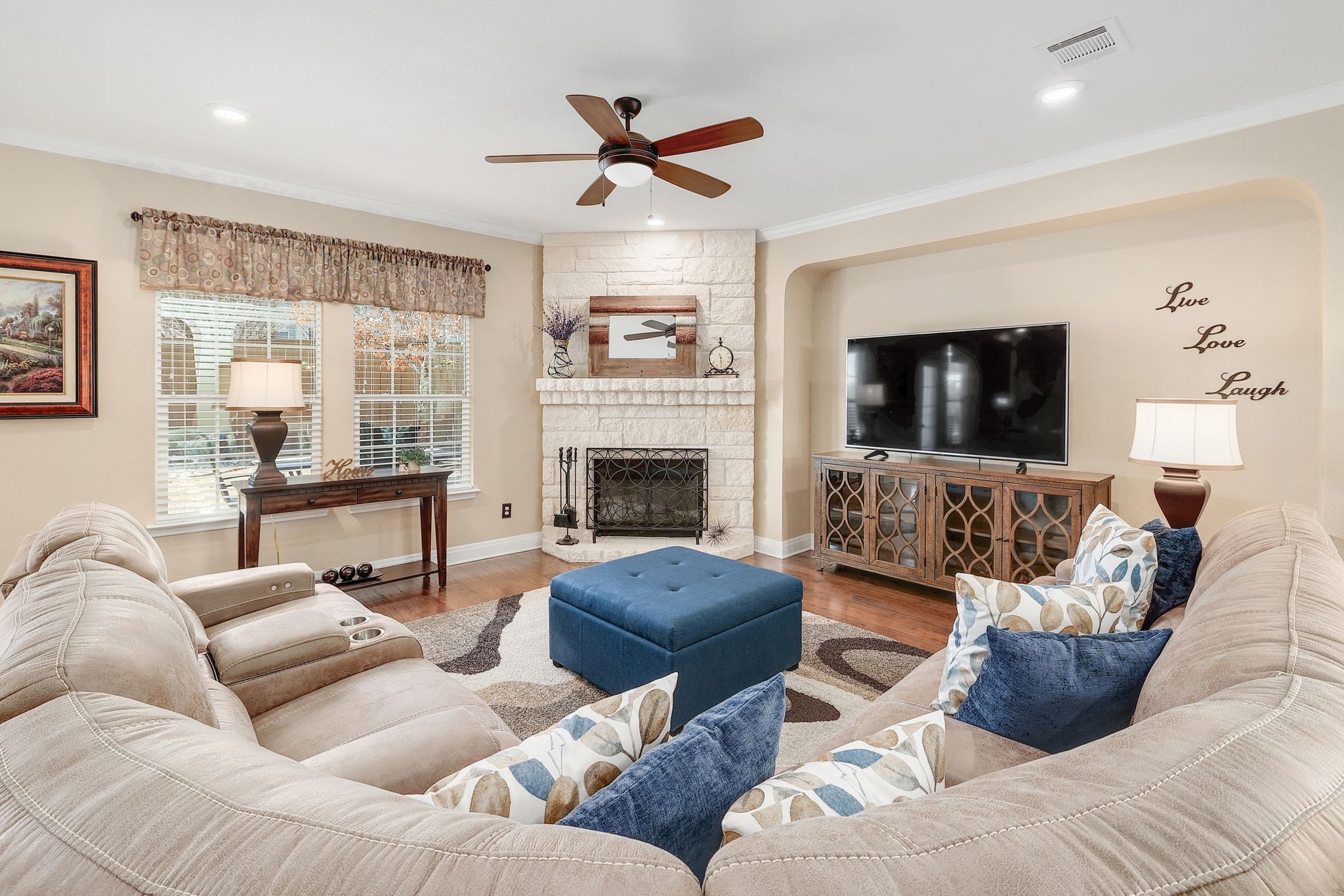 646 Landon Samuel Loop Pflugerville, TX 78660 - Photo 5 of 40 a living room with furniture and a fireplace