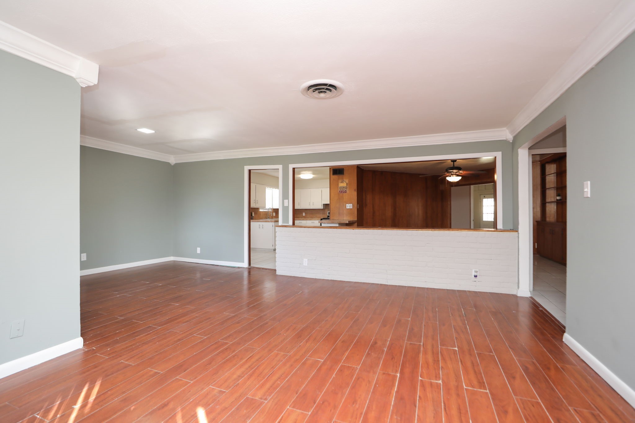 8235 Dover Street Houston, TX 77061 - Photo 8 of 36 a view of an empty room with wooden floor