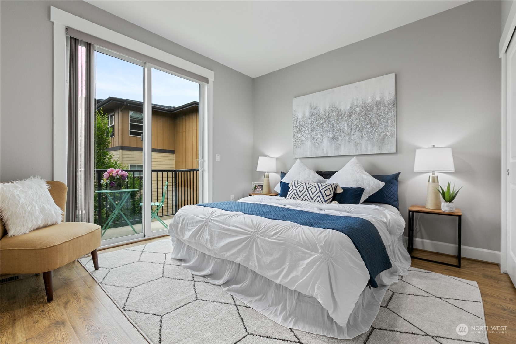 2115 201st Place Southeast, Unit D3 Bothell, WA 98012 - Photo 12 of 25 a spacious bedroom with a bed and glass window