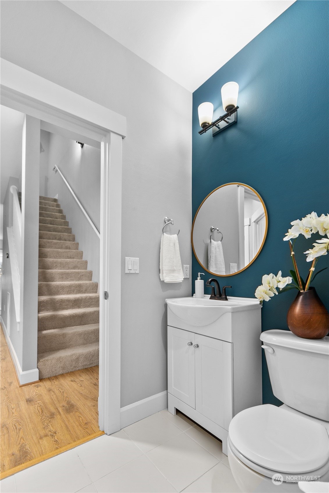 2115 201st Place Southeast, Unit D3 Bothell, WA 98012 - Photo 14 of 25 a bathroom with a toilet a sink and mirror
