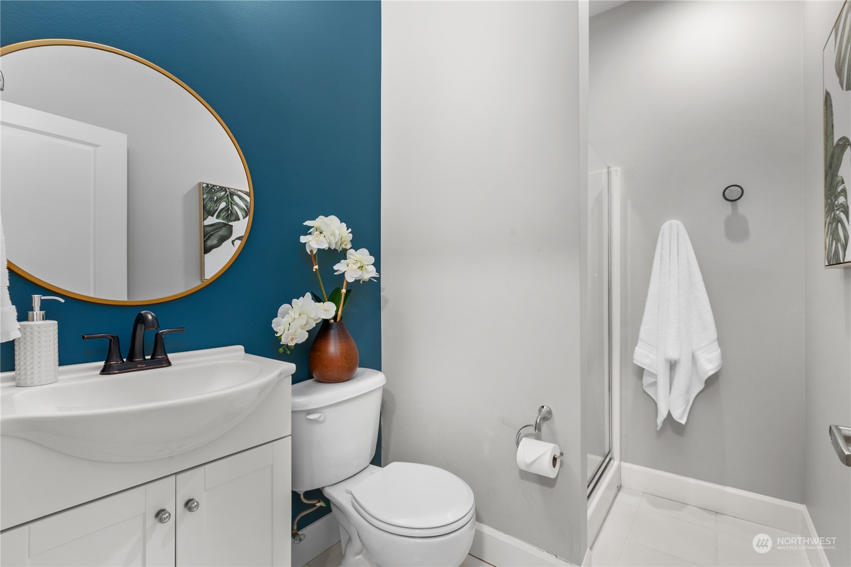 2115 201st Place Southeast, Unit D3 Bothell, WA 98012 - Photo 15 of 25 a bathroom with a toilet sink and mirror