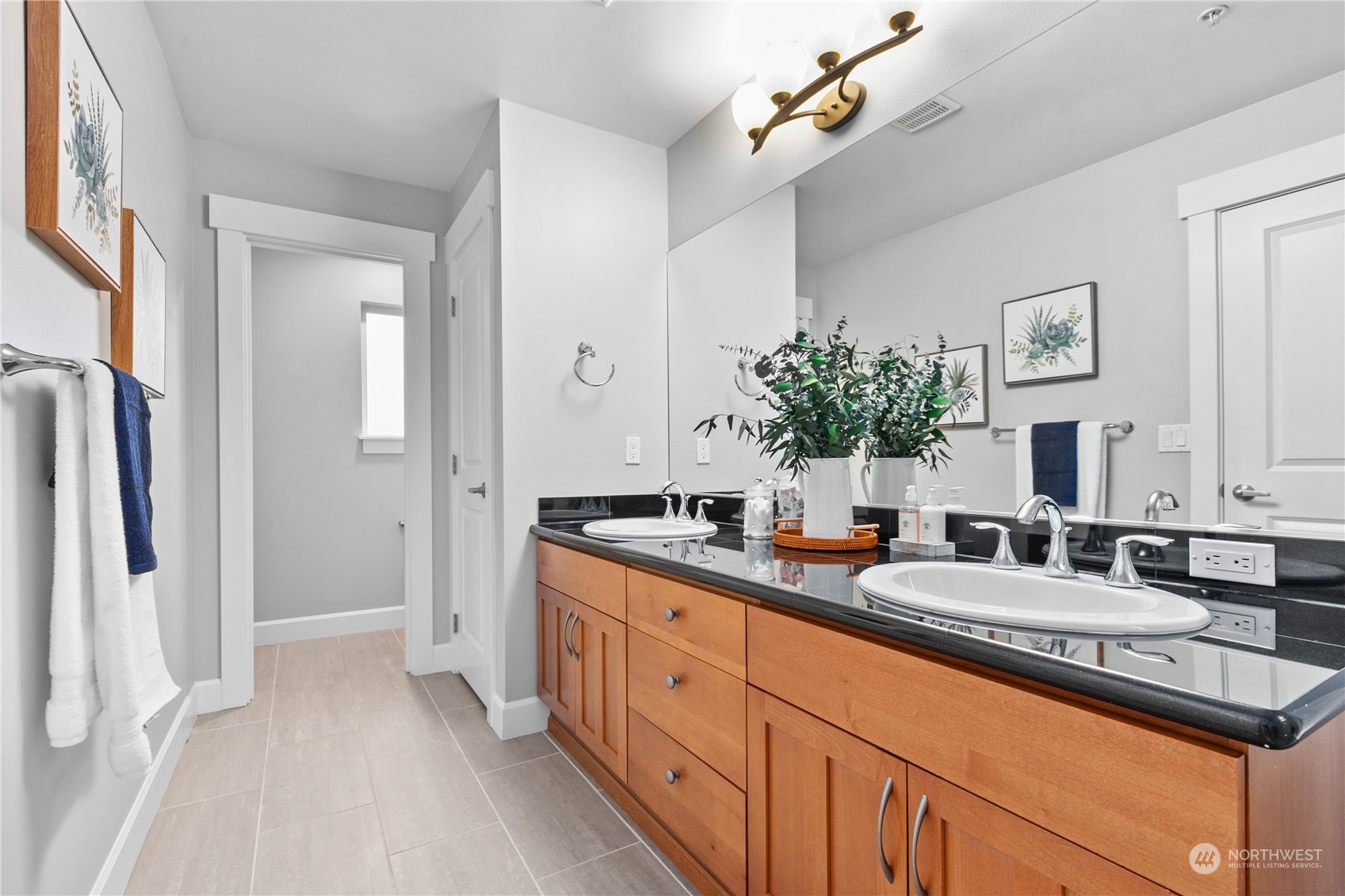 2115 201st Place Southeast, Unit D3 Bothell, WA 98012 - Photo 19 of 25 a en suite bathroom with double sink and a mirror