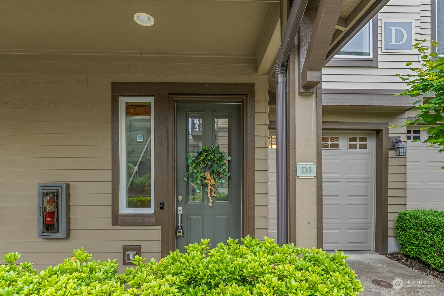 2115 201st Place Southeast, Unit D3 Bothell, WA 98012 - Photo 2 of 25 a front view of a house with a yard