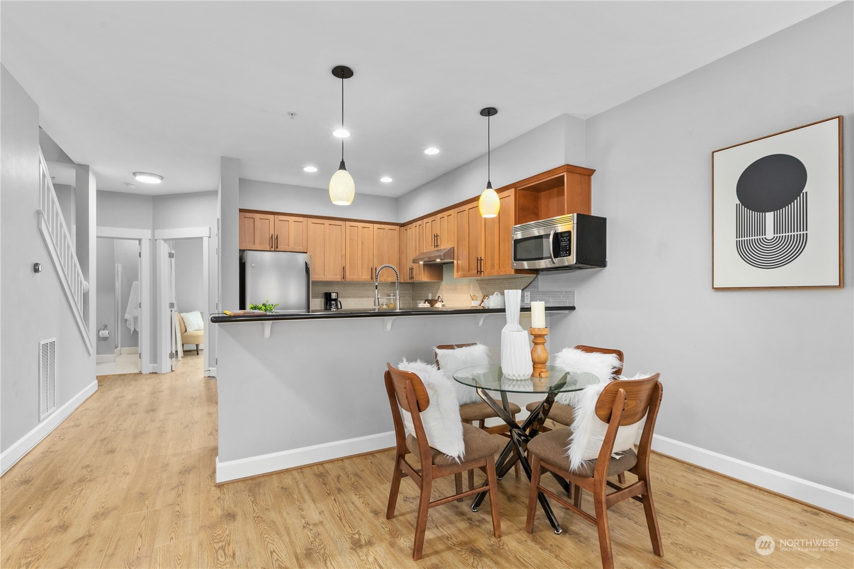 2115 201st Place Southeast, Unit D3 Bothell, WA 98012 - Photo 8 of 25 a view of a dining room with furniture and wooden floor