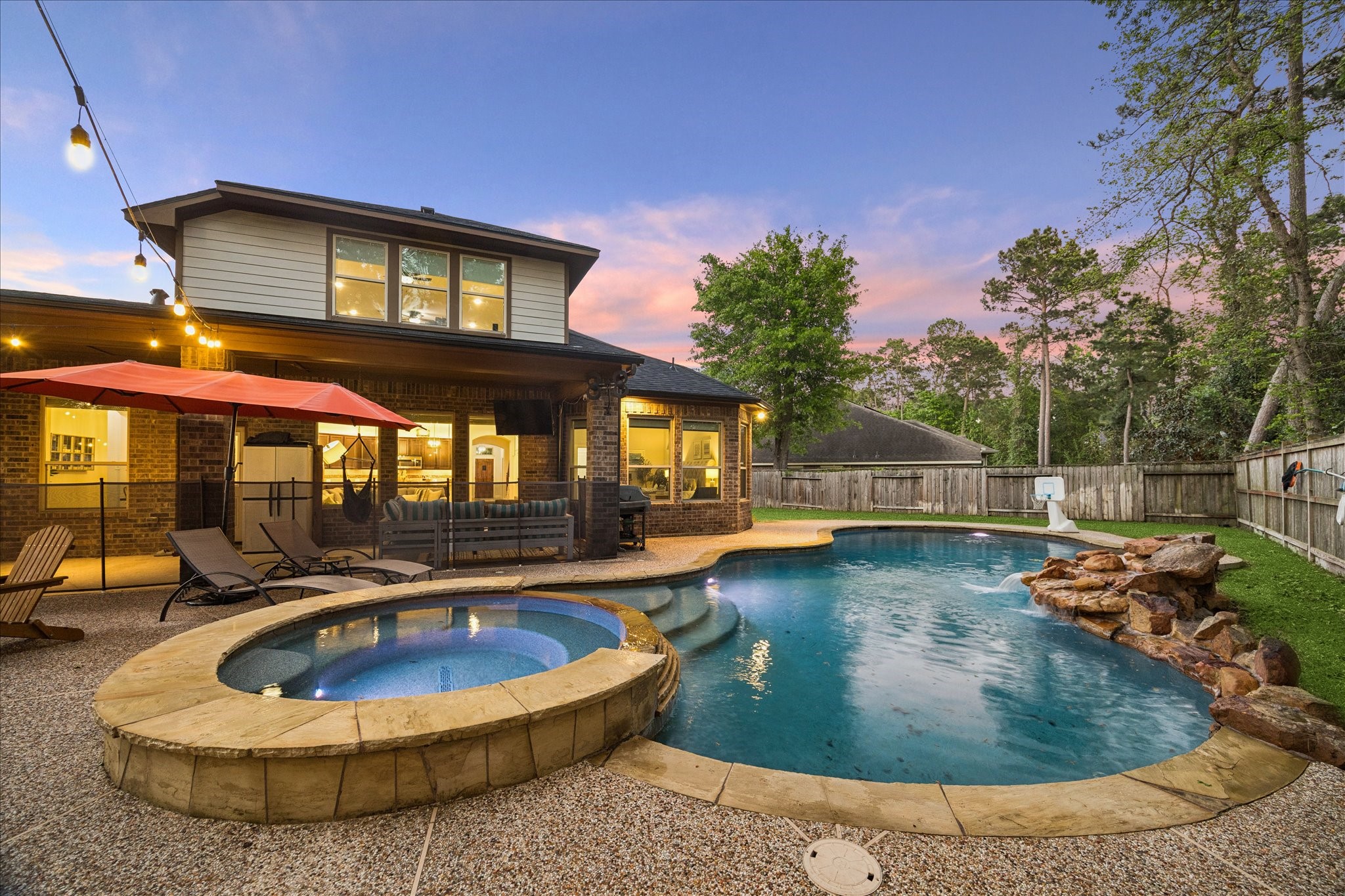 31618 Ember Trail Lane Spring, TX 77386 - Photo 30 of 44 Large backyard oasis w/ covered deck, saltwater pool/spa and lounge area