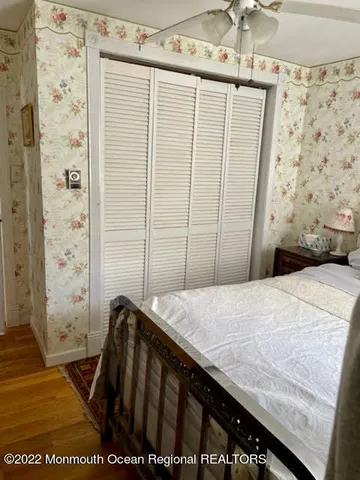 a bedroom with a bed and a shower