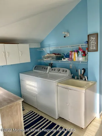 a utility room with washer and dryer