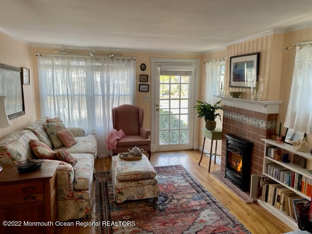816 Atlantic Avenue, Unit A Point Pleasant, NJ 08742 - Photo 4 of 23 a living room with furniture and a fireplace