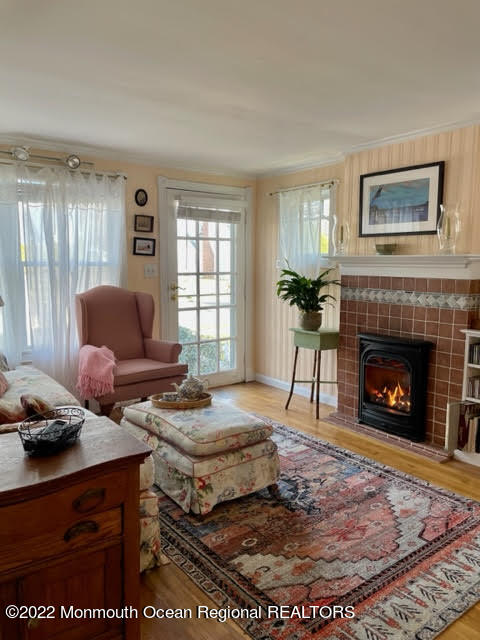 816 Atlantic Avenue, Unit A Point Pleasant, NJ 08742 - Photo 7 of 23 a living room with furniture and a fireplace