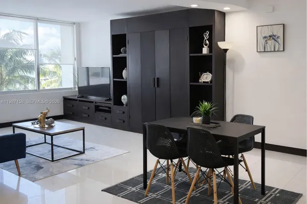 a view of a livingroom with furniture and window