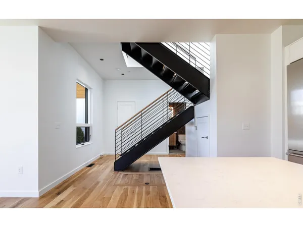 a view of an entryway with wooden floor