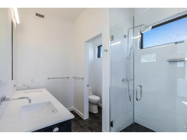 a bathroom with a sink and toilet