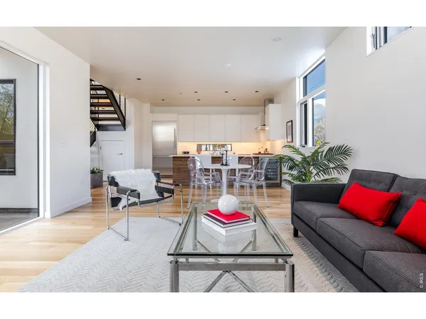 a living room with patio furniture and a couch