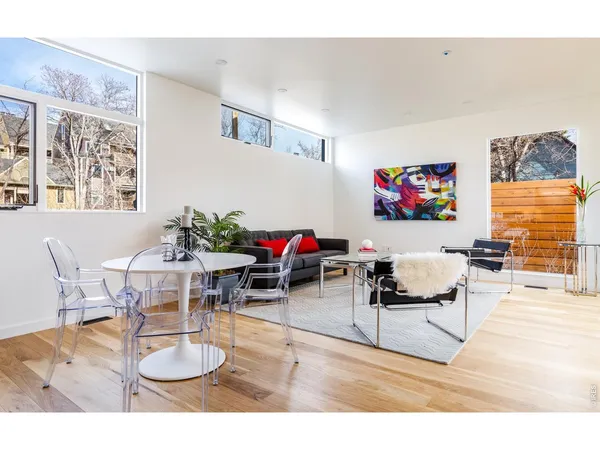 a living room with furniture dining room and a flat screen tv