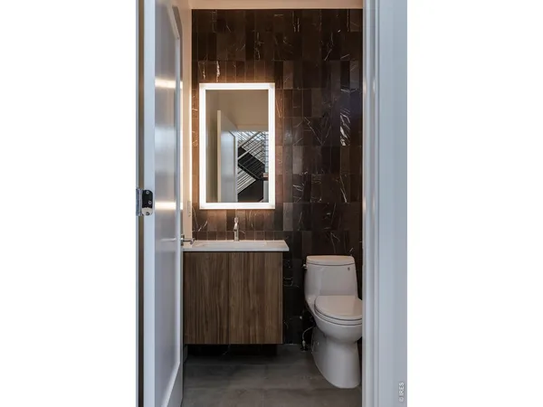 a bathroom with a toilet and a sink