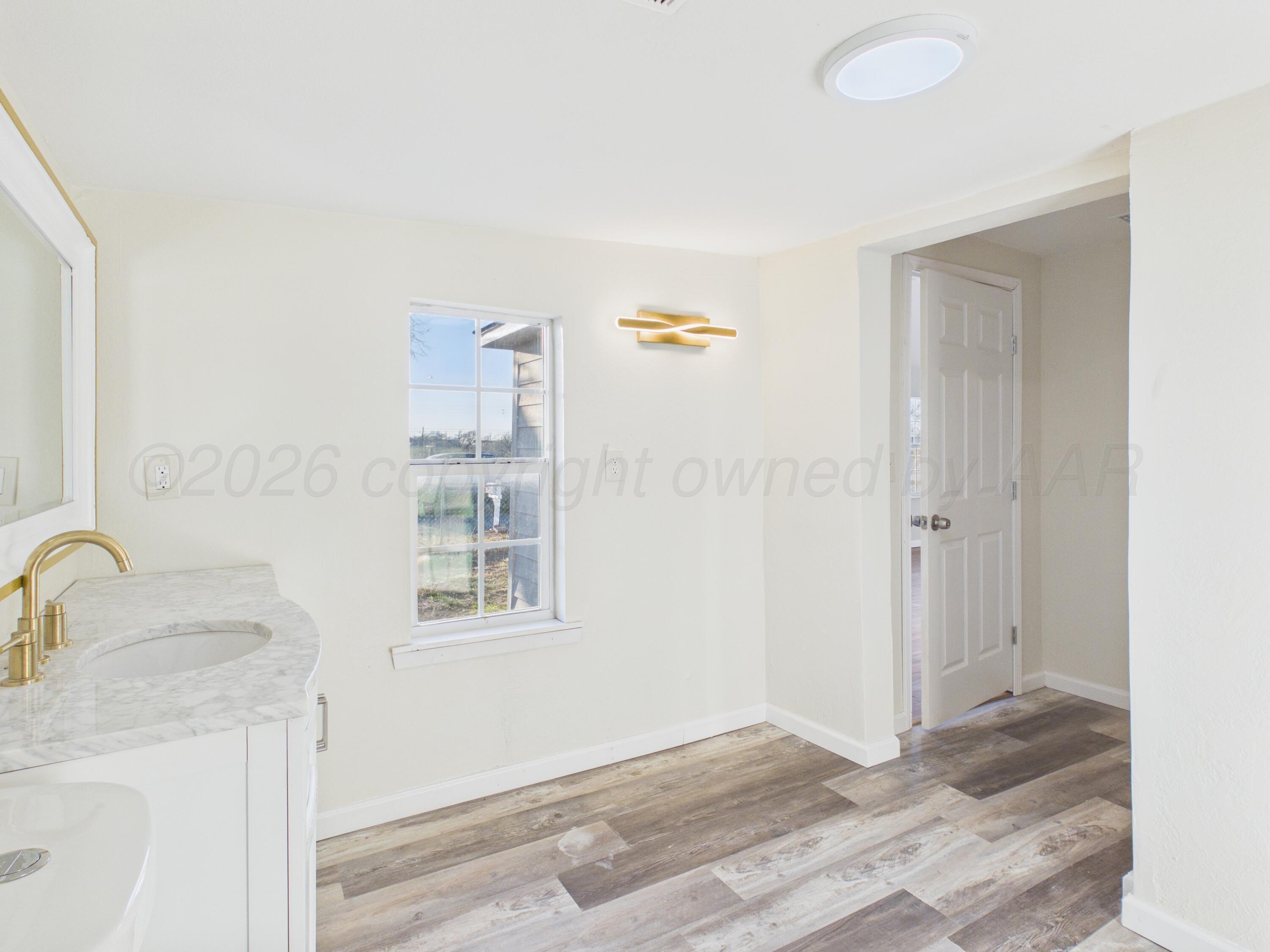 310 North Virginia Street Amarillo, TX 79106 - Photo 12 of 33 a view of a sink a faucet and a window in a room