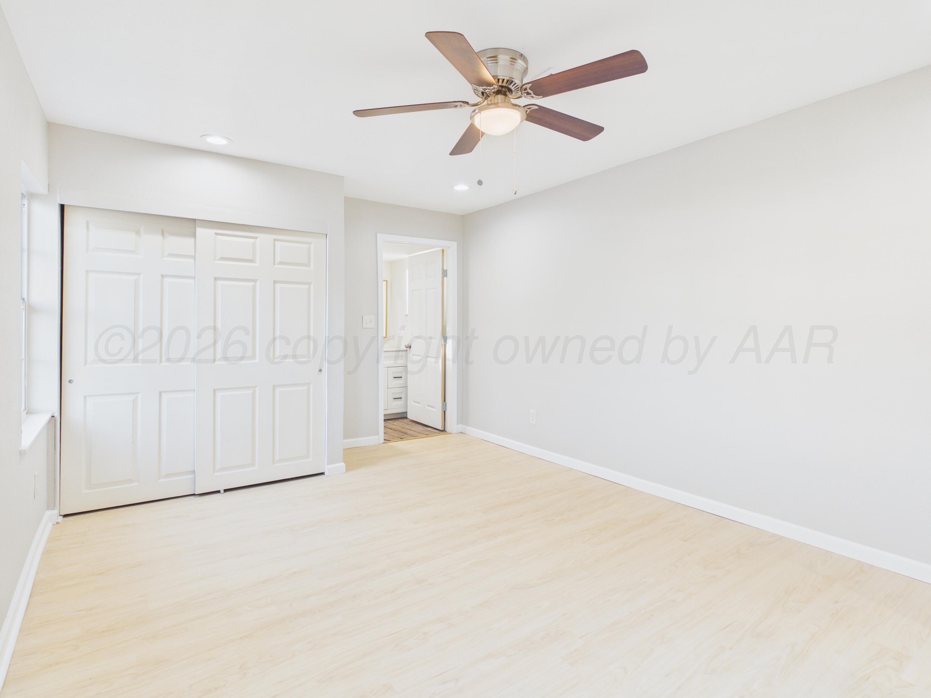 310 North Virginia Street Amarillo, TX 79106 - Photo 22 of 33 an empty room with a ceiling fan