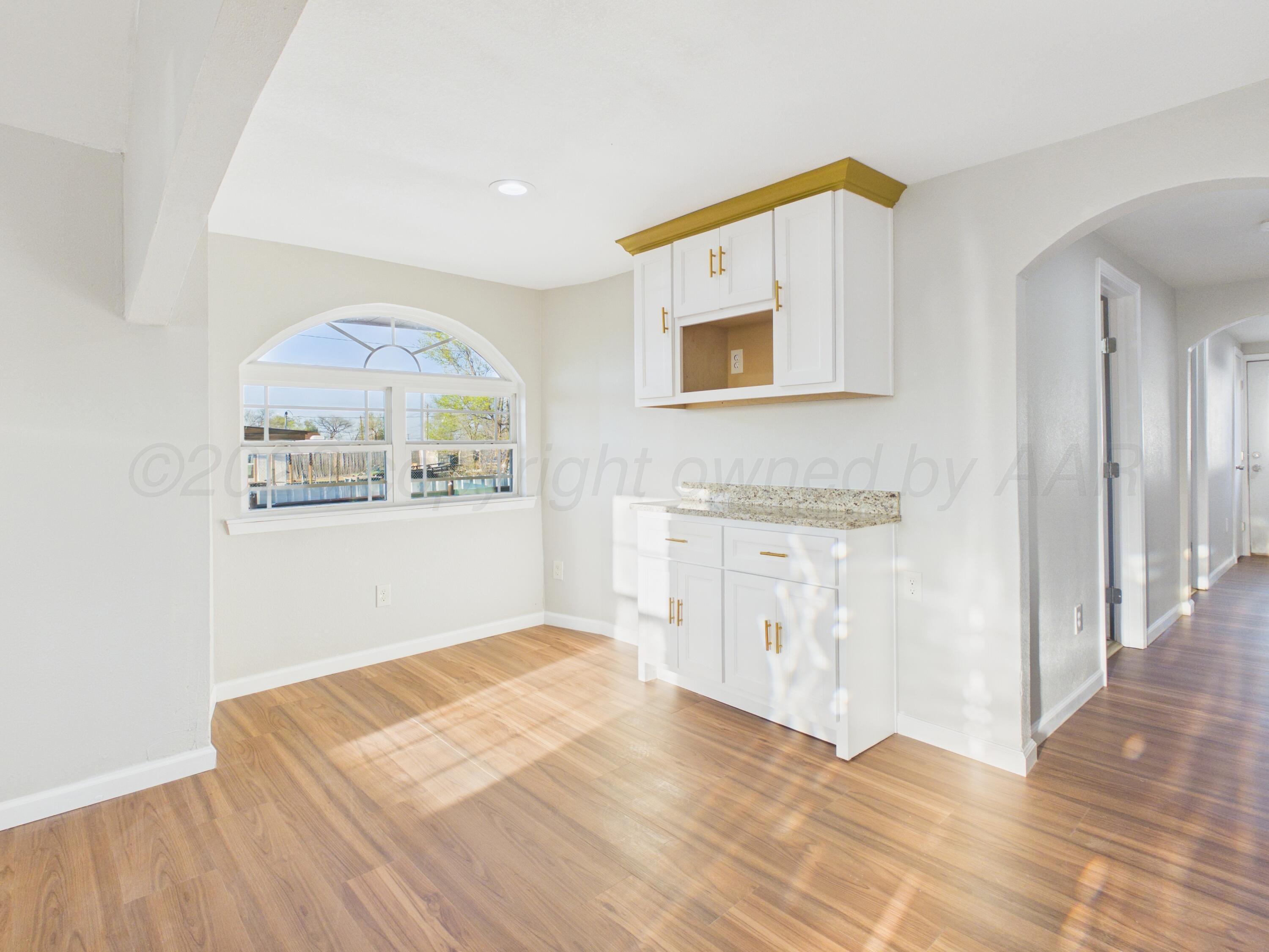 310 North Virginia Street Amarillo, TX 79106 - Photo 9 of 33 a bedroom with a bed and a painting on the wall