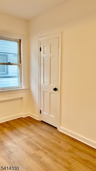458 Totowa Road, Unit 3 Totowa, NJ 07512 - Photo 12 of 20 an empty room with wooden floor and windows