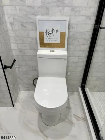 a bathroom with a toilet and a sink