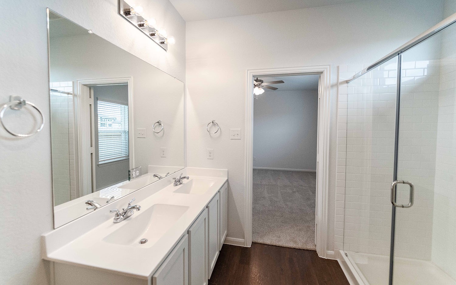 1718 Windrose Bend Angleton, TX 77515 - Photo 8 of 14 a spacious bathroom with a shower sink and mirror