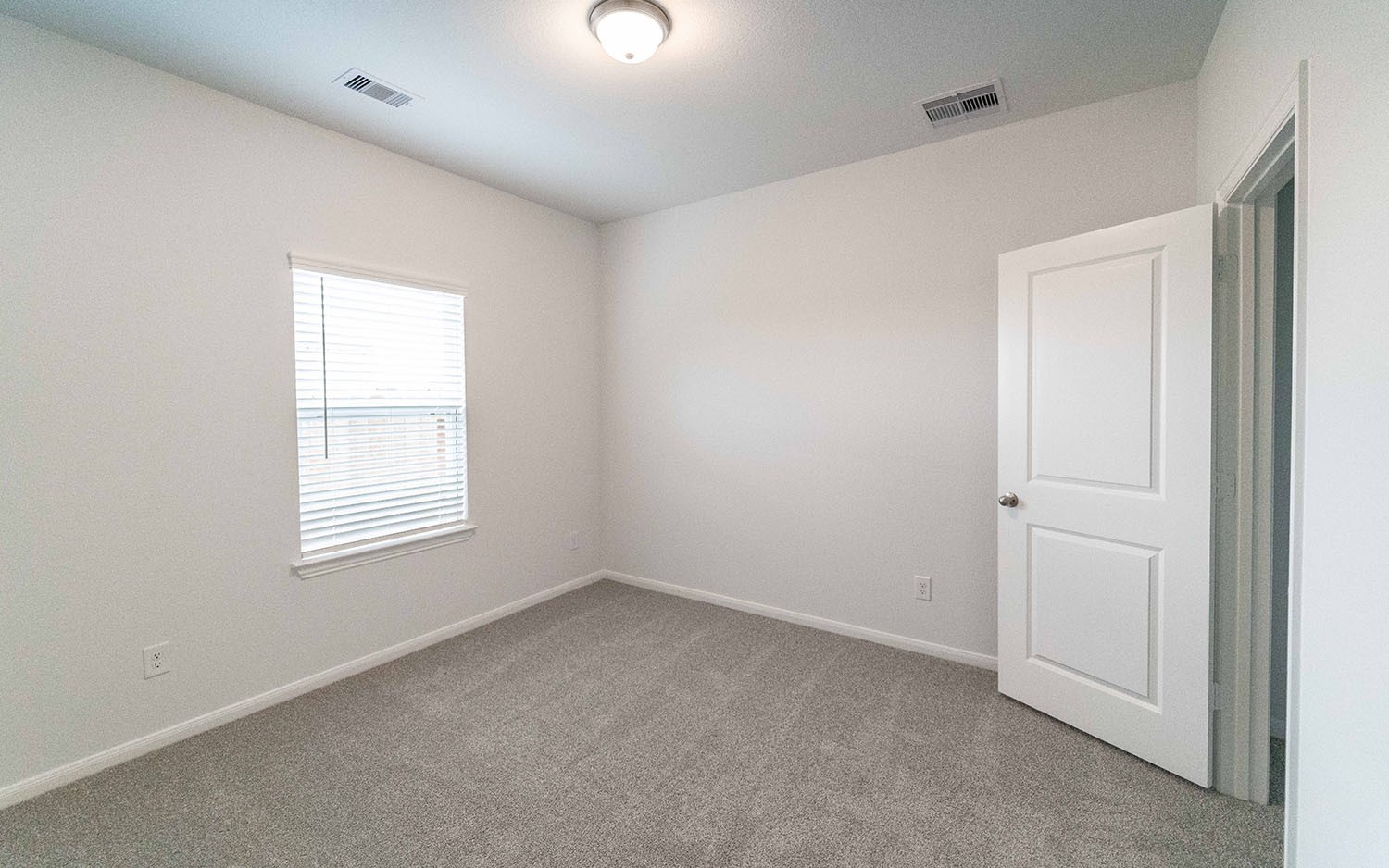 1718 Windrose Bend Angleton, TX 77515 - Photo 9 of 14 an empty room with a window