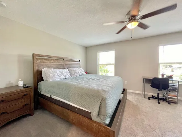 a bedroom with furniture and a window