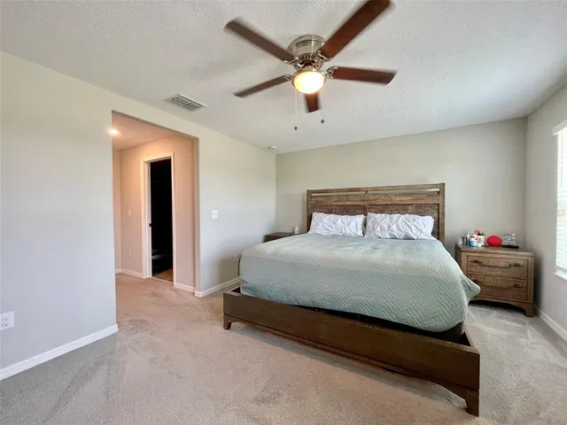a view of a livingroom with workspace and a flat screen tv