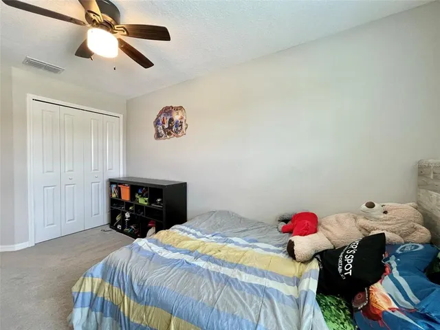 a bathroom with a double vanity sink toilet mirror and shower