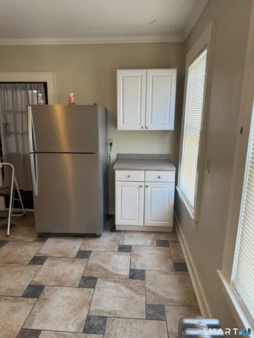 a view of a kitchen with a fridge