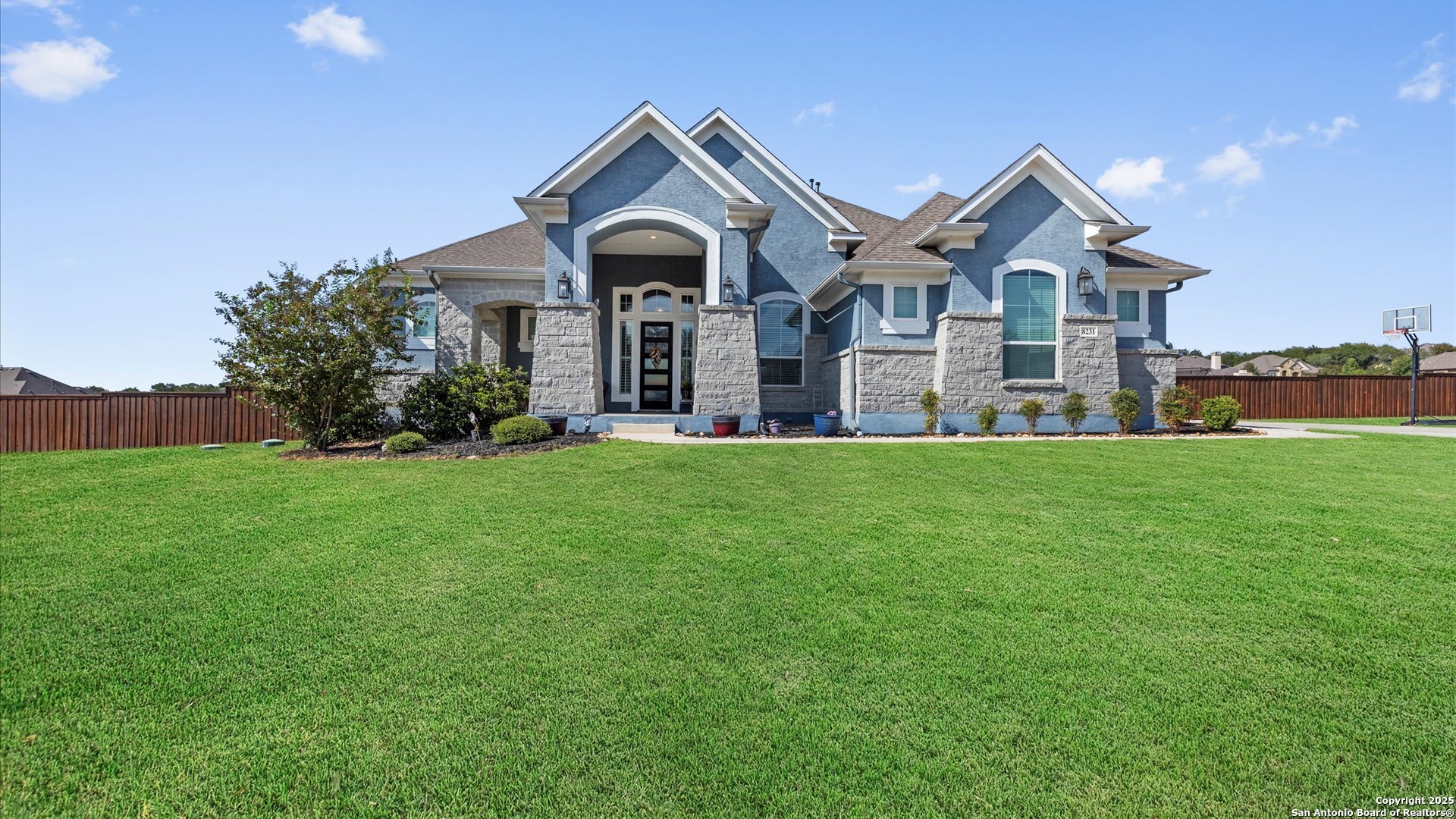 a front view of house with yard and green space