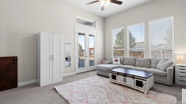 a living room with furniture and a window