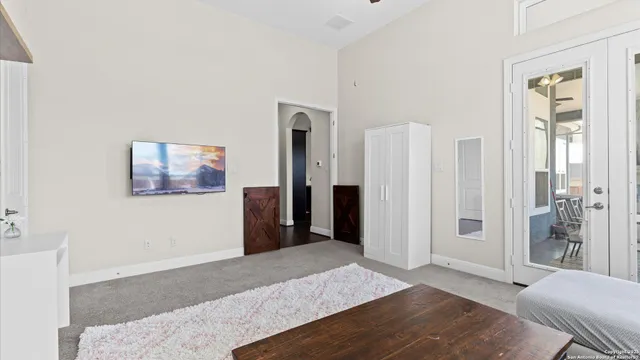 a bed room with a bed and a chandelier