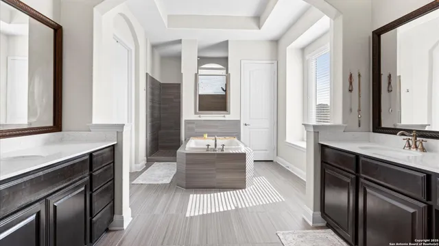 a bedroom with a bed and a night stand