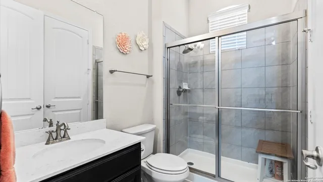 a bedroom with a bed and a cabinets